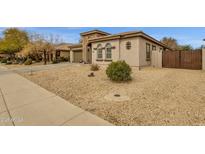 Charming single-story home featuring neutral stucco, stone accents, and low-maintenance desert landscaping at 2514 E Espada Trl, Casa Grande, AZ 85194