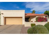 Charming single-story home with a terra cotta tile roof, desert landscaping, and a two-car garage at 6138 E Nance St, Mesa, AZ 85215