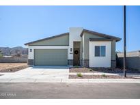 Charming single-story home featuring a neutral color palette and a well-manicured front yard at 909 E Desert Ln, Phoenix, AZ 85042
