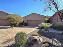 Attractive single-story home featuring a brick driveway and a well-manicured desert-scape at 13139 N Northstar Dr, Fountain Hills, AZ 85268