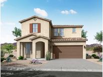 Charming two-story home features a covered porch, desert landscaping, and a two-car garage at 21291 W Edgemont Ave, Buckeye, AZ 85396