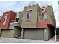 Contemporary townhome featuring a private garage and colorful exterior accents at 3113 E Danbury Rd # 5, Phoenix, AZ 85032