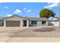Charming single-story home featuring a well-maintained yard and a two-car garage at 4612 S Dorsey Ln, Tempe, AZ 85282