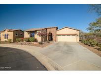 Charming single-story home featuring stucco siding, a three-car garage, and a neatly landscaped front yard at 16445 S 176Th Ln, Goodyear, AZ 85338