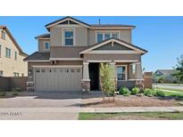 Inviting two-story home with a two car garage and manicured front yard at 3875 E Appaloosa Rd, Gilbert, AZ 85296