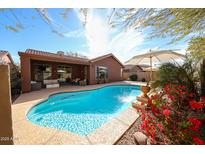 Backyard pool features a large patio with plenty of lounge furniture for outdoor entertaining at 39632 N Lost Legend Dr, Phoenix, AZ 85086
