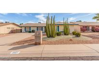 Charming single-story home featuring desert landscaping, including cacti and gravel accents at 4401 E Walatowa St, Phoenix, AZ 85044