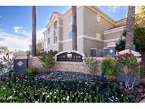 Attractive community sign surrounded by colorful flowers and lush landscaping at 4465 E Paradise Village S Pkwy # 1179, Phoenix, AZ 85032
