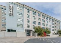 Stylish building with a modern design, lush landscaping, and street-level access in an urban setting at 535 W Thomas Rd # 211, Phoenix, AZ 85013