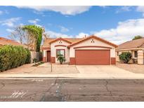 Charming single-story home with a well-maintained front yard and a two-car garage at 8139 E Osage Ave, Mesa, AZ 85212