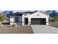 Inviting single-story home with a stucco facade, desert landscaping, and attached two-car garage at 18891 E Bruno Dr, Gold Canyon, AZ 85118