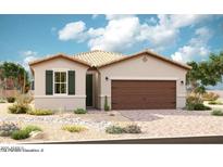 Charming single-story home showcasing desert landscaping, a two-car garage, and a neutral color palette at 39993 W Anne Ln, Maricopa, AZ 85138