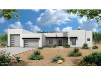 Contemporary home featuring a clean design, desert landscaping, and two-car garage at 7175 E Rancho Del Oro Dr, Scottsdale, AZ 85266