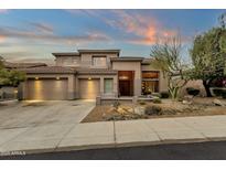 Beautiful two-story home with a three-car garage and desert landscaping at 11036 E Evans Rd, Scottsdale, AZ 85255
