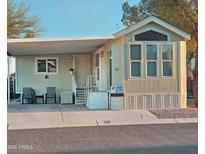 Inviting single-story home with a covered entrance, 'Home For Sale' sign, and well-maintained landscaping at 124 S 54Th St # 42, Mesa, AZ 85206