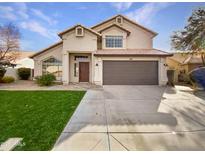 Charming two-story home with well-manicured lawn and inviting front entrance at 1651 E Erie St, Chandler, AZ 85225
