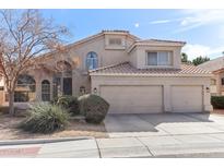 Charming two-story home featuring a three-car garage, desert landscaping, and a tile roof at 1901 W Mulberry Dr, Chandler, AZ 85286