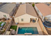 An aerial view of a single Gathering home with a sparkling blue pool and low maintenance yard at 4845 E Iolite St, San Tan Valley, AZ 85143