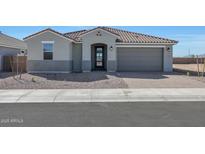 Charming single-story home featuring a well-manicured landscape and a two-car garage at 1292 S 185Th Dr, Goodyear, AZ 85338