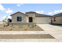 Inviting single-story home with a low-maintenance desert landscape and neutral color palette at 42855 W Palo Abeto Dr, Maricopa, AZ 85138