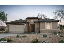 Charming single-story home featuring desert landscaping, a two-car garage, and a welcoming front entrance at 42875 W Palo Abeto Dr, Maricopa, AZ 85138