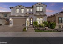 Charming two-story home featuring a well-manicured front yard and a two car garage at 10134 W Cashman Dr, Peoria, AZ 85383