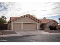 Single Gathering home featuring a neutral color palette, two-car garage and tile roof at 1119 S Presidio Dr, Gilbert, AZ 85233