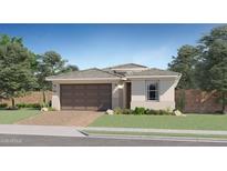 New construction home with a brick driveway and a two-car garage at 15751 W Pioneer St, Goodyear, AZ 85338