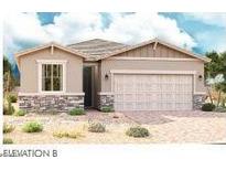 Charming single-story home featuring stone accents and a two-car garage at 21555 N Rummler Ln, Maricopa, AZ 85138