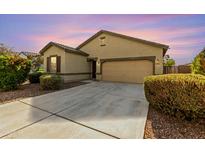 Charming single-story home with manicured landscaping and a spacious driveway at 2379 E San Miguel Dr, Casa Grande, AZ 85194