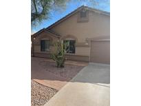 Charming single-story home with desert landscaping and a two-car garage at 455 W Gary Ave, Gilbert, AZ 85233