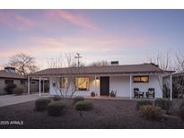 Charming single-story home featuring a covered front porch and desert landscaping at 6114 N 8Th St, Phoenix, AZ 85014