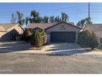 Charming single-story home featuring a spacious driveway and a well-maintained front yard at 7551 W Pasadena Ave, Glendale, AZ 85303