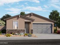 New construction home featuring a two-car garage, stone accents, desert landscaping and neutral color palette at 17426 W Eva St, Waddell, AZ 85355