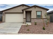 Charming single-story home with a two-car garage and easy-to-maintain front yard at 17426 W Eva St, Waddell, AZ 85355