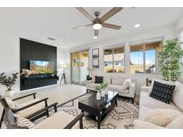 Bright living room featuring neutral tones, modern furniture, and access to outdoor living at 3890 E Dublin St, Gilbert, AZ 85295