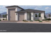 Beautiful single-story home featuring a modern elevation, well-manicured landscaping and a three car garage at 5520 W Hopi Trl, Laveen, AZ 85339