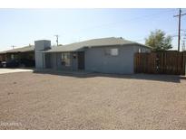 Charming single-story home featuring a neutral color, low landscaping, and a welcoming facade at 8134 N 29Th Ave, Phoenix, AZ 85051