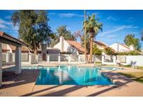 Enjoy the community pool with a splash, offering a refreshing retreat in a lush environment at 2140 E Rosarita Dr, Tempe, AZ 85281