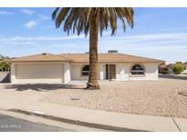 Charming single-story home featuring a neutral-toned exterior, well-kept landscaping, and a welcoming entrance at 4662 E Escondido Ave, Mesa, AZ 85206