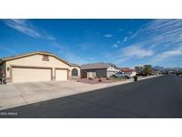 Charming single-story home with well-maintained front yard and attached two-car garage at 11460 E Dartmouth St, Mesa, AZ 85207