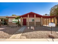 Charming single-story home with brick accents, desert landscaping, and covered carport at 2205 E Linda Ct, Phoenix, AZ 85022