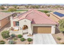 Inviting single-story home with a tile roof, two-car garage, and a charming front patio near the golf course at 3956 N San Marin Dr, Florence, AZ 85132