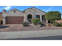 Charming single-story home featuring a well-manicured front yard and a two-car garage at 4424 N Potomac Dr, Florence, AZ 85132