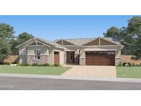 Beautiful single-story home with stone accents, desert landscaping, and a two-car garage at 25135 N 177Th Dr, Surprise, AZ 85387