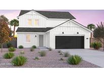 Charming new construction home featuring a black garage door, white paint, and desert landscaping at 10255 S Bickwell Trl, Apache Junction, AZ 85120