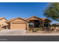 Charming home with a well-maintained desert-scape, a two-car garage, and beautiful, clear, blue skies at 11258 E Ocaso Ave, Mesa, AZ 85212