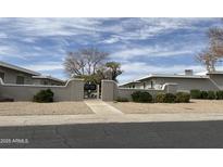 Charming community entrance with landscaped grounds and decorative gate in a desirable neighborhood at 13808 N 108Th Dr, Sun City, AZ 85351