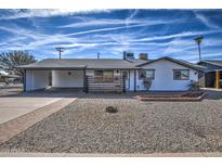 Charming single-story home with modern xeriscaping and a covered carport at 901 W Parkway Blvd, Tempe, AZ 85281