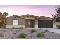 Charming single-story home featuring a two-car garage and a beautifully landscaped xeriscaped front yard at 1229 W J Waltz Way, Apache Junction, AZ 85120